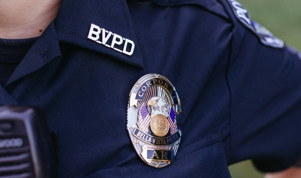A Bella Vista Police Department corporal’s badge on a uniform shirt